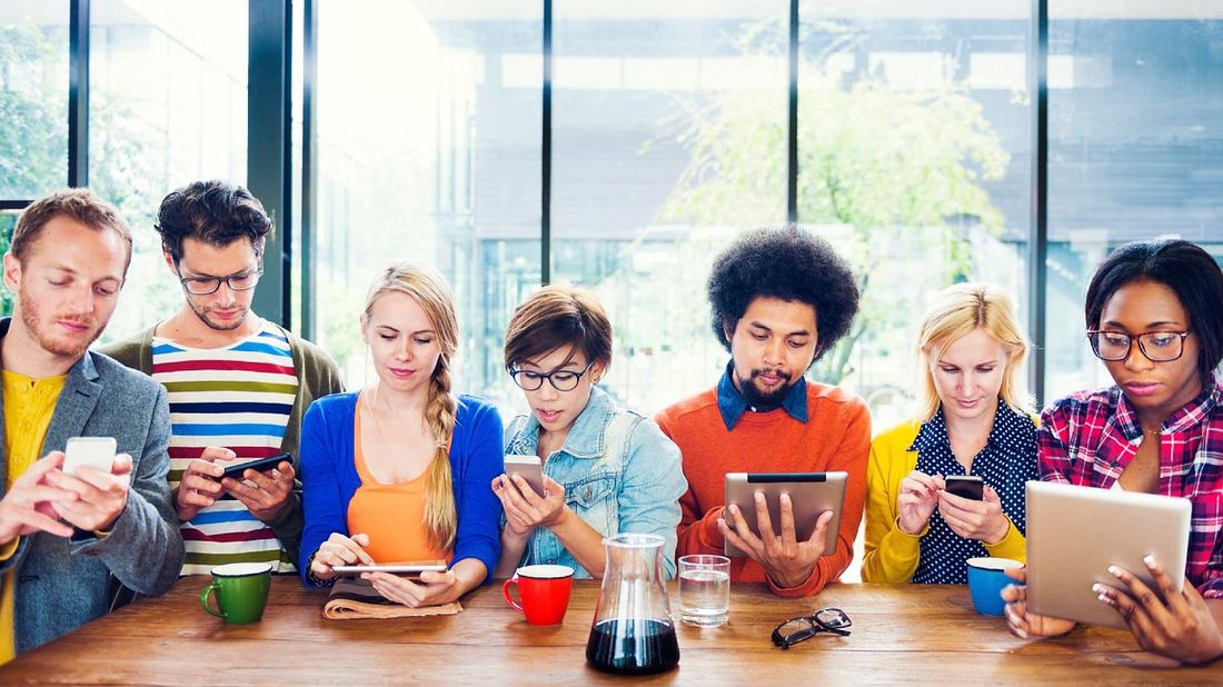 Young people on devices 